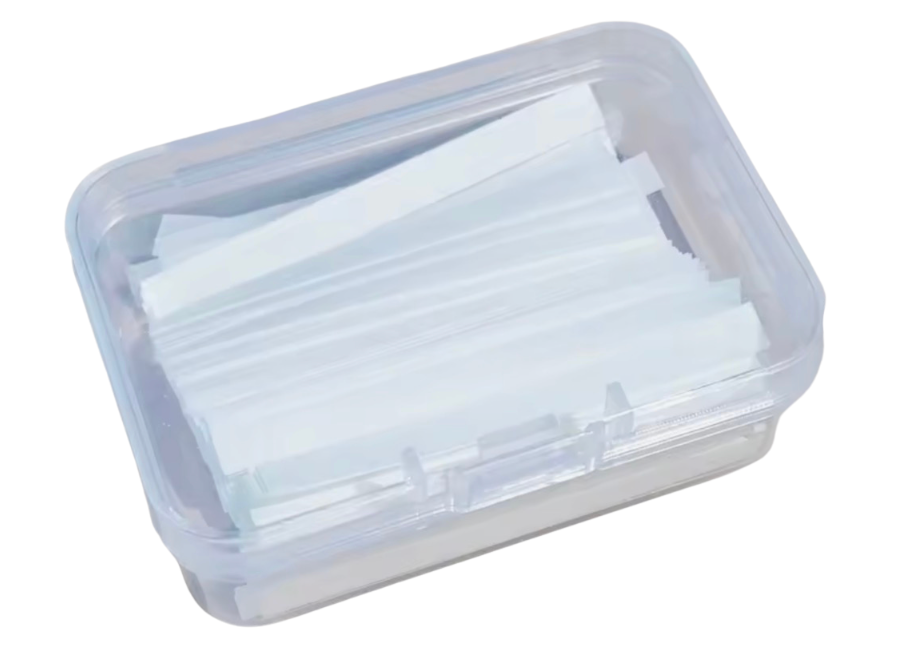 Clear plastic container with white paper strips on a white background