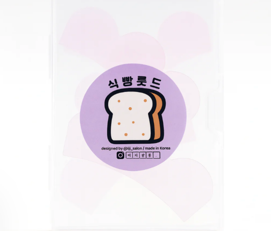 Sticker with a bread design on a purple circle with text, on a white background