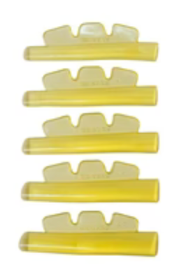 Set of yellow plastic clips on a white background