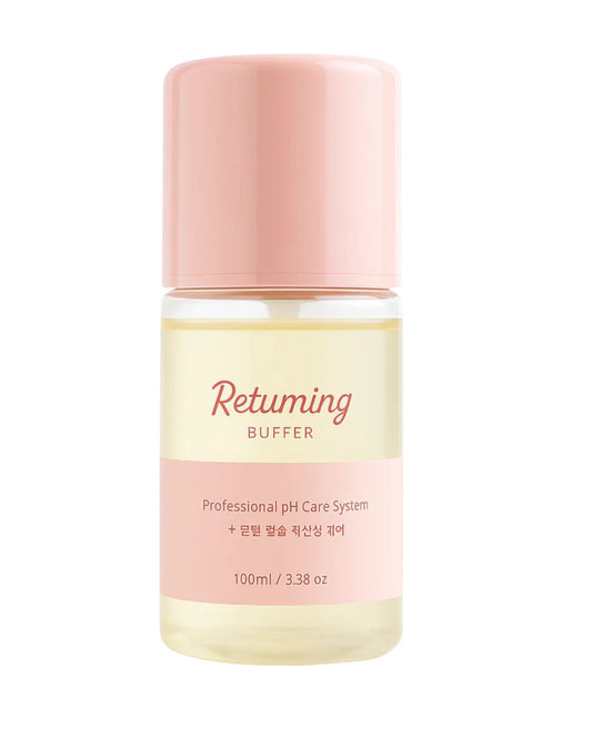 Skincare bottle labeled 'Returning Buffer' with pink cap and body on a white background